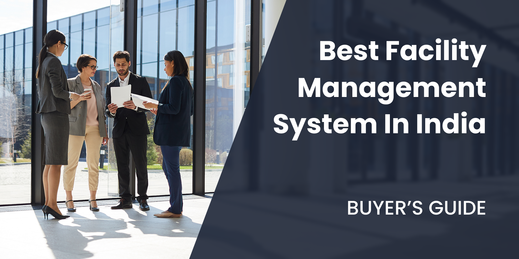 Group of professionals discussing the best facility management system in India in a modern office setting.